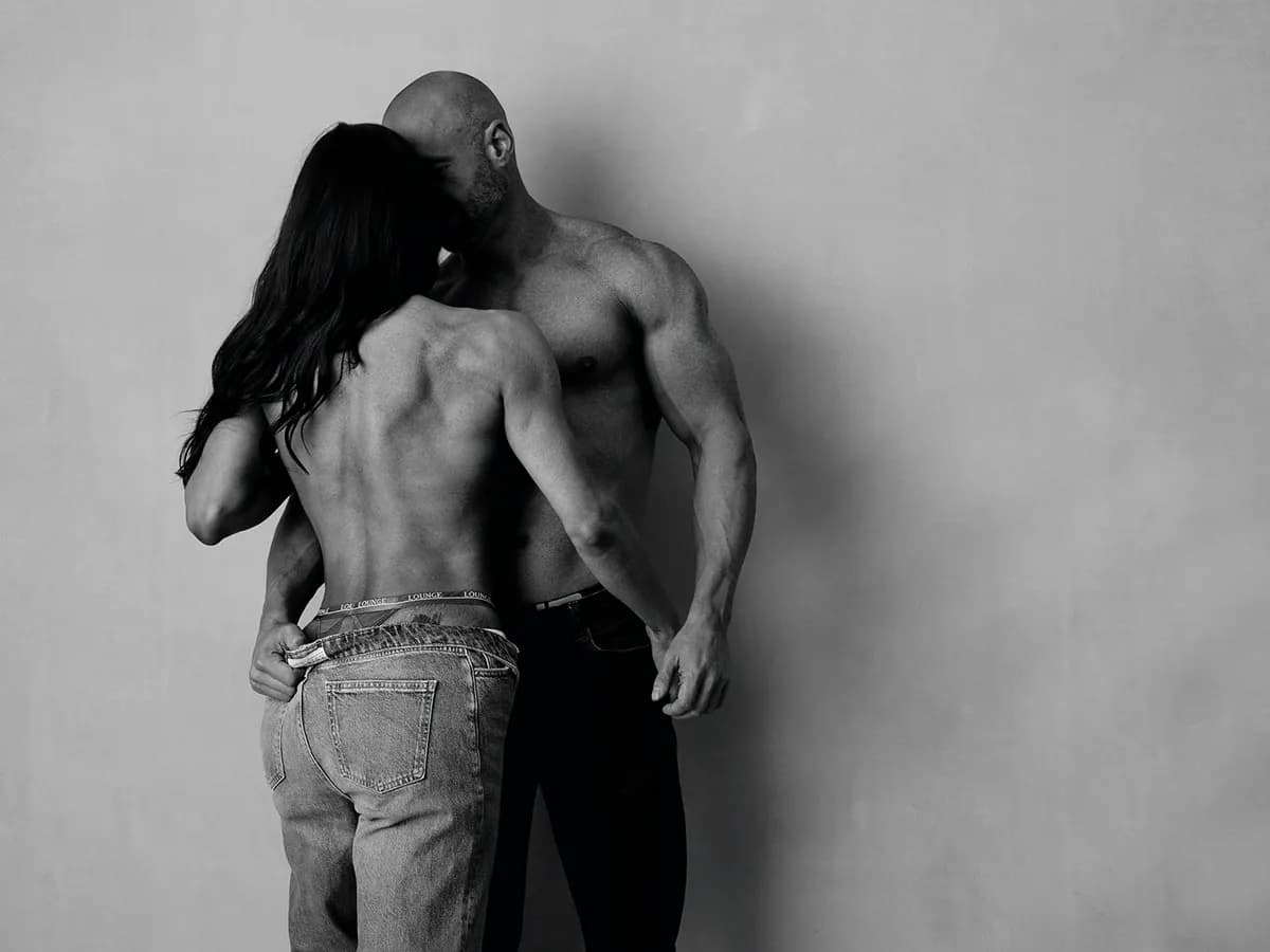 Fitness couple photographed together in styled studio session