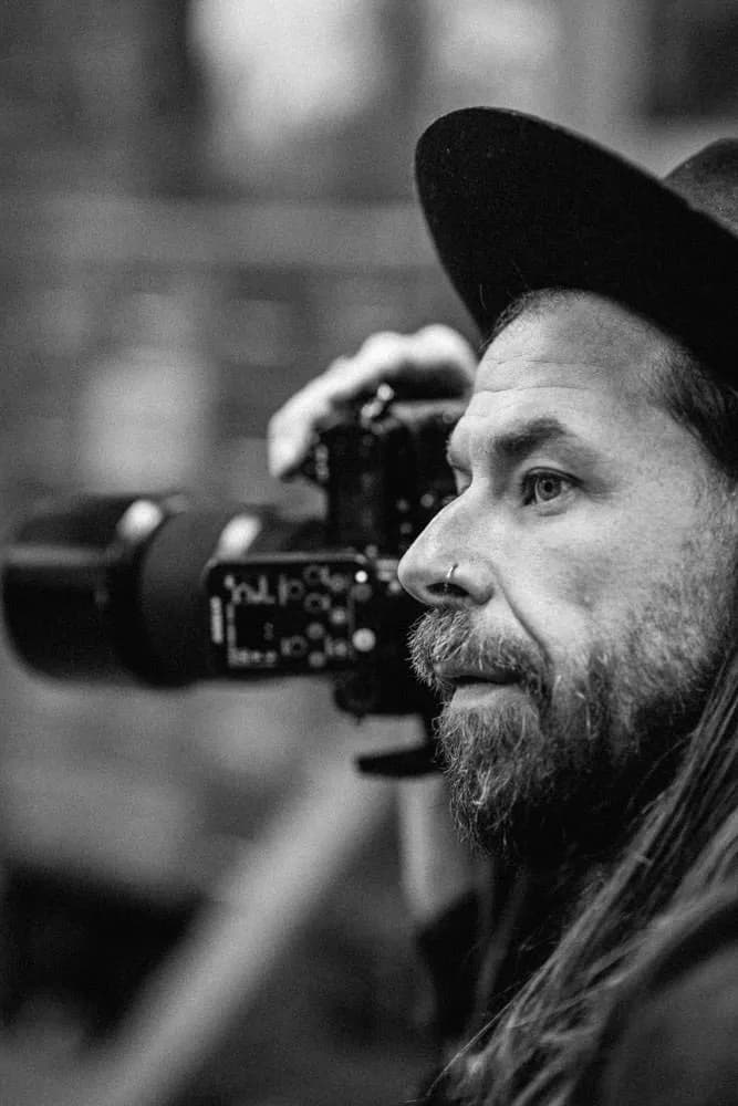 Christopher Bailey looking through the viewfinder during a studio session