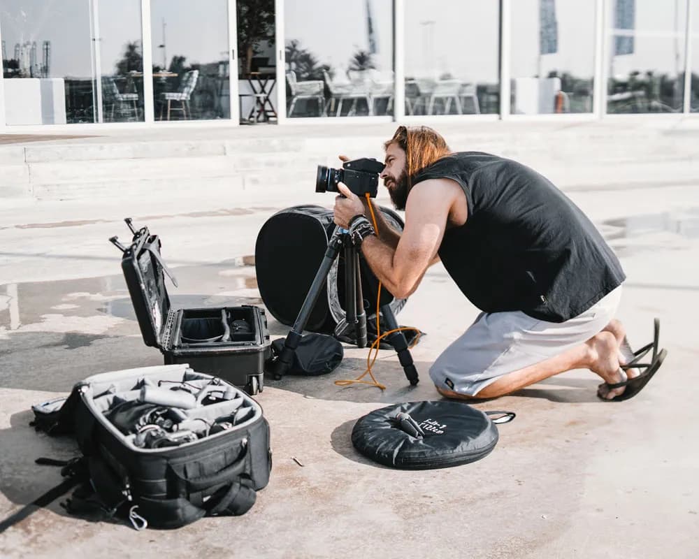 Christopher Bailey shooting on location with professional lighting setup