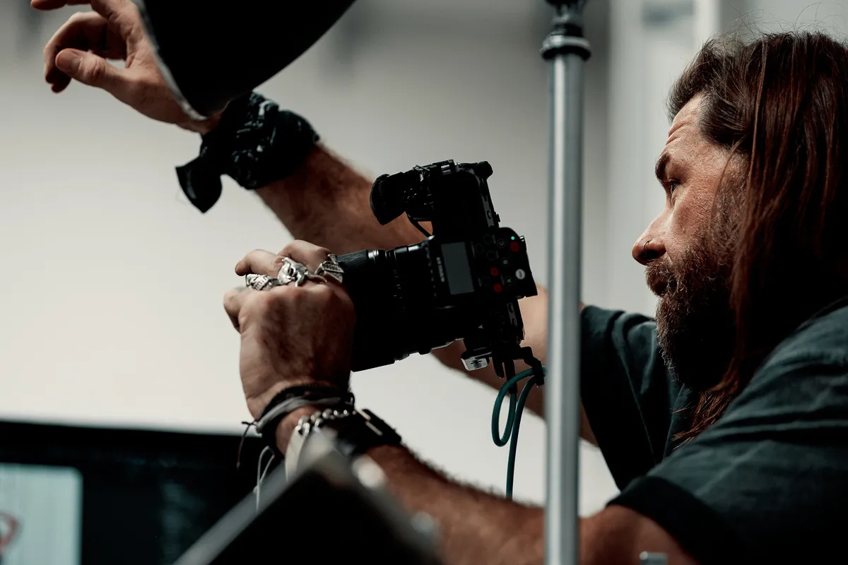Christopher Bailey adjusting lighting during a studio photoshoot