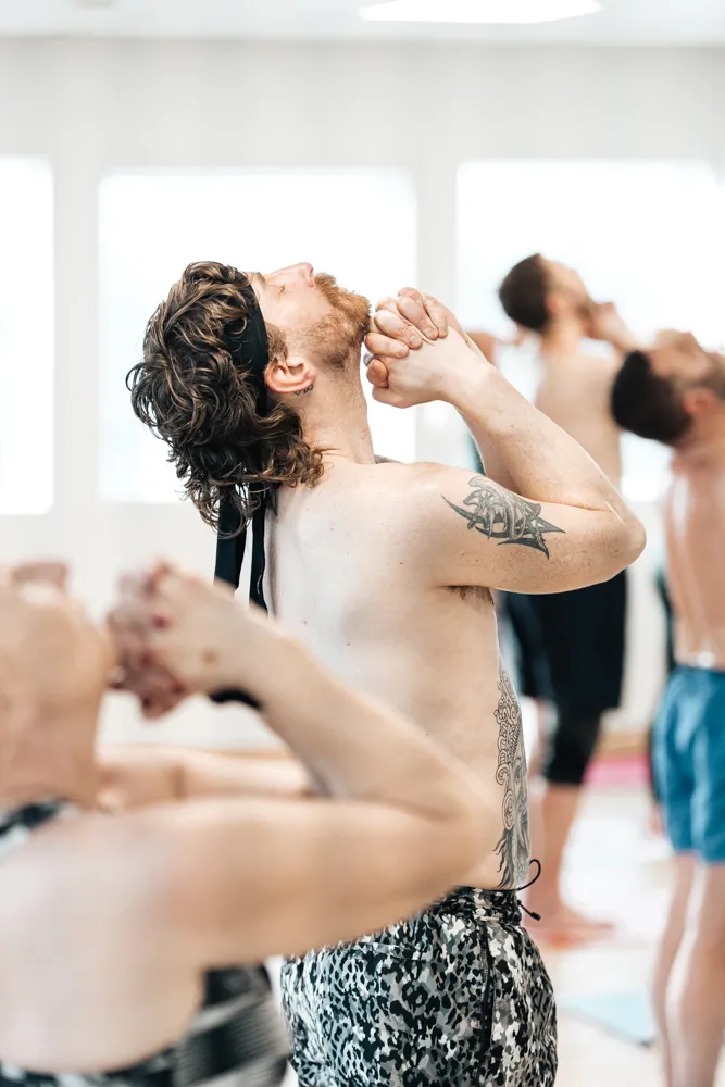 Male yoga practitioner in hot yoga class photographed by Bailey