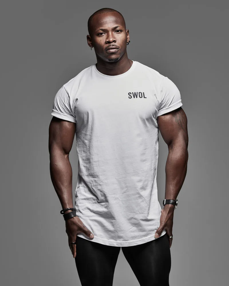 Gym photography showcasing physique and real training equipment