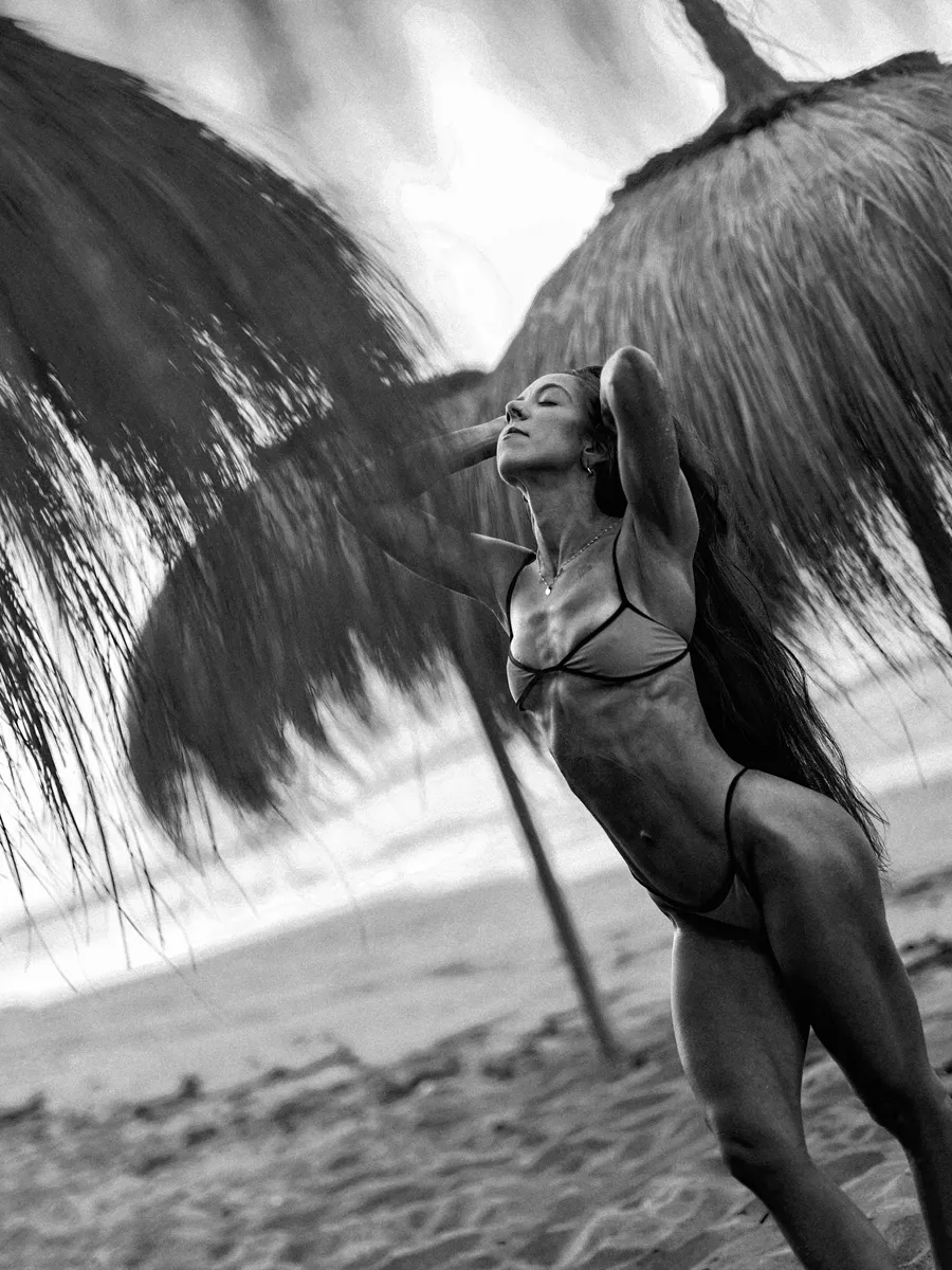 Sara Basha sunrise beach fitness photoshoot on dark Marbella sand