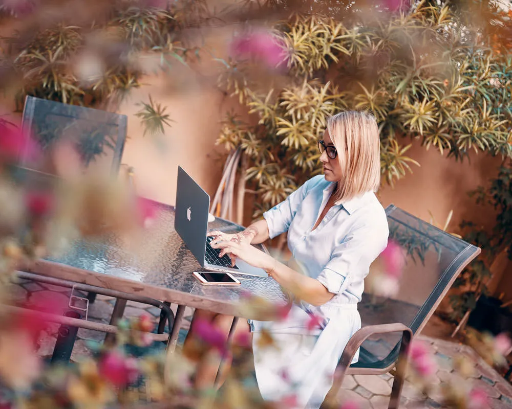 Fitness coach working on laptop - lifestyle branding content